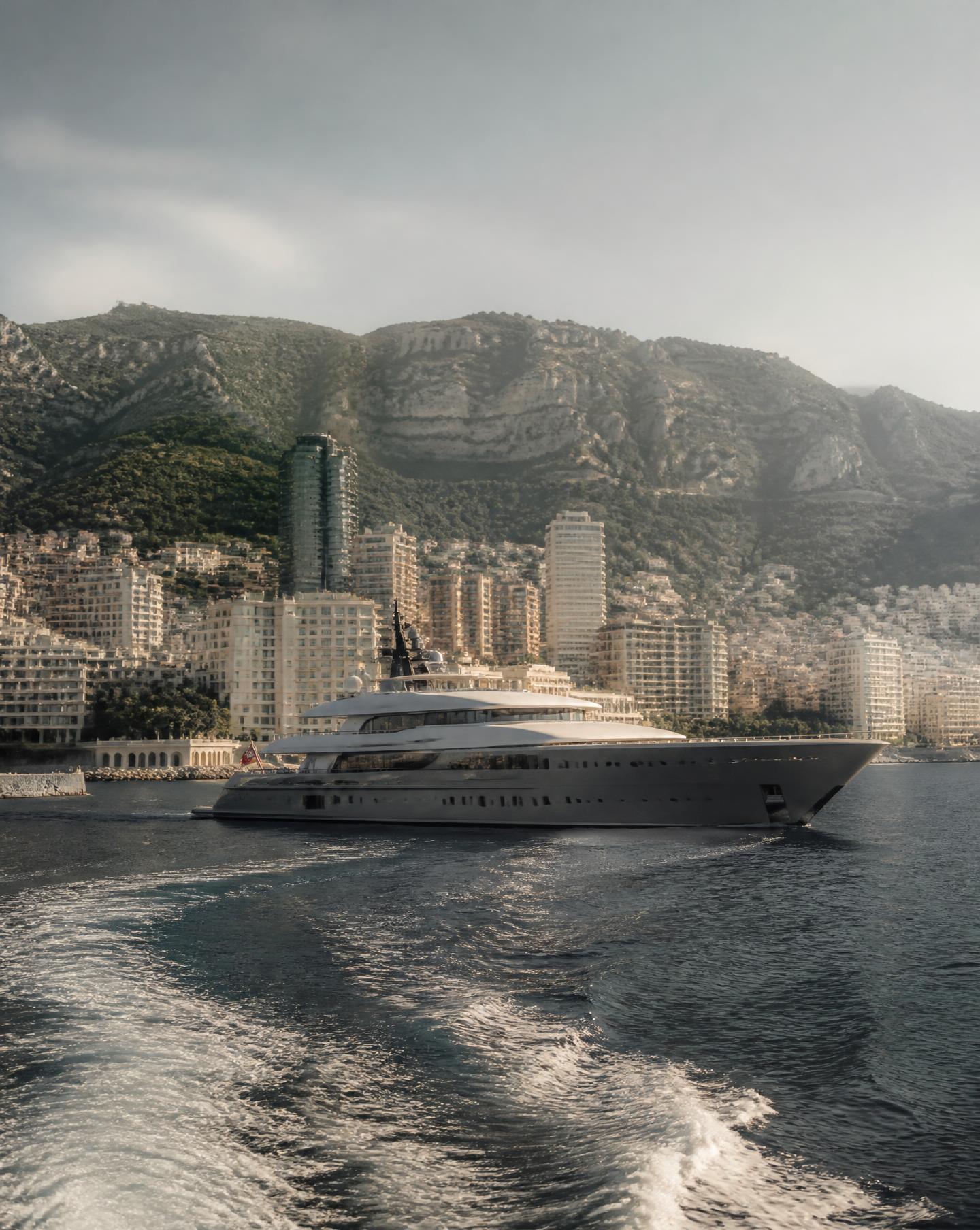 Superyacht cruising past the Monaco coastline